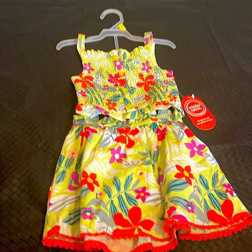 Little girl skirt set yellow with multiple colors .